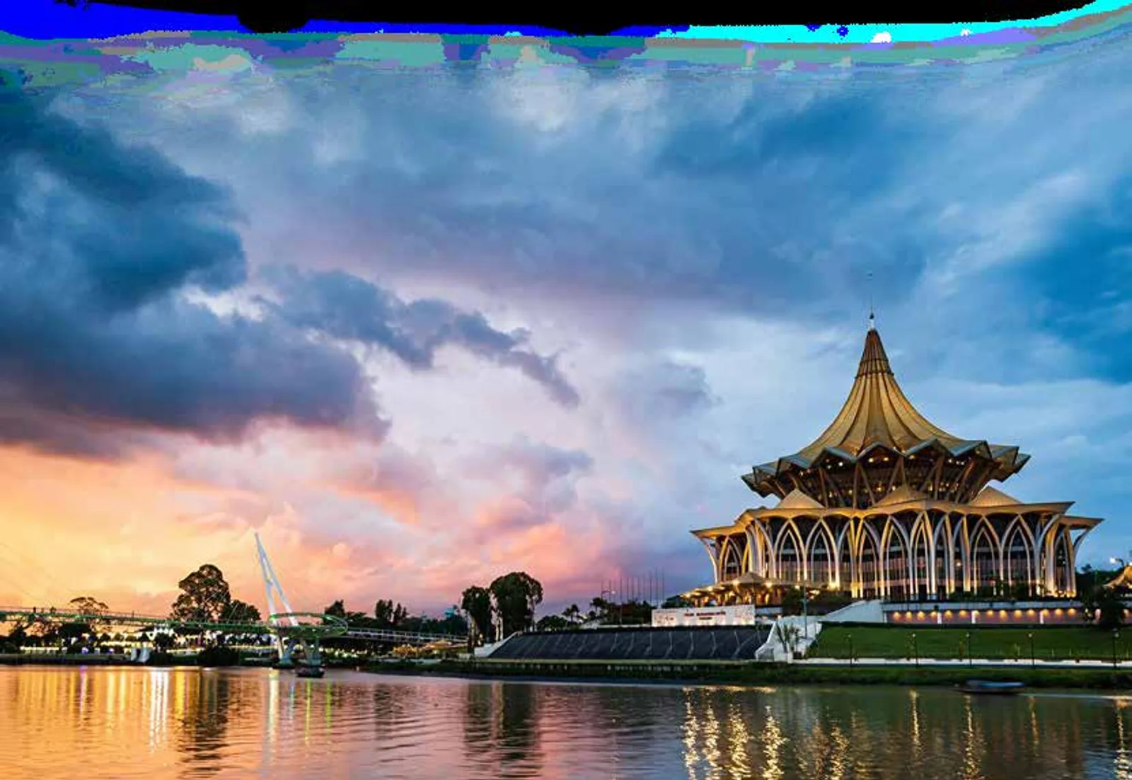 The Sarawak State Legislative Assembly building on the Sarawak River at dusk, Kuching